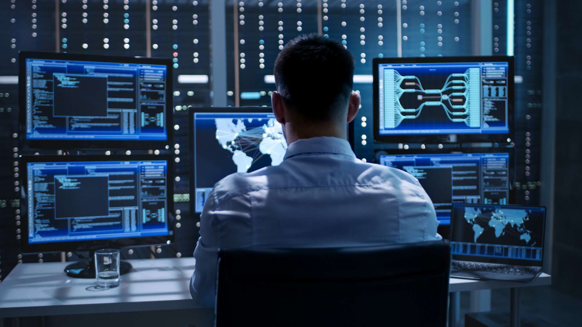 Female hacker wearing a hoodie using a dangerous virus